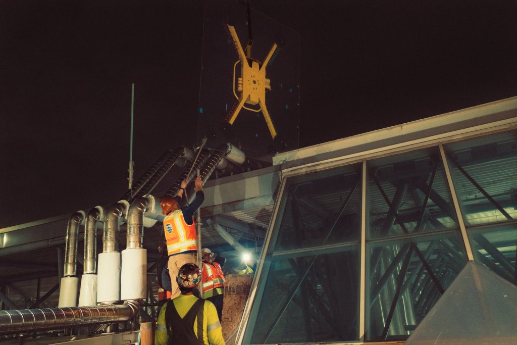 Overnight crane glass lift at Oakland International Airport led by Joshua Pratchard of East Bay Glass