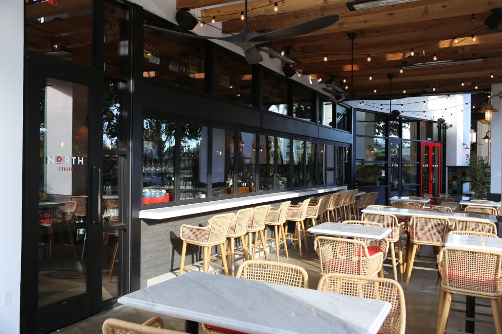 NanaWall folding bar windows and Arcadia storefront installed by East Bay Glass at North Italia in Walnut Creek