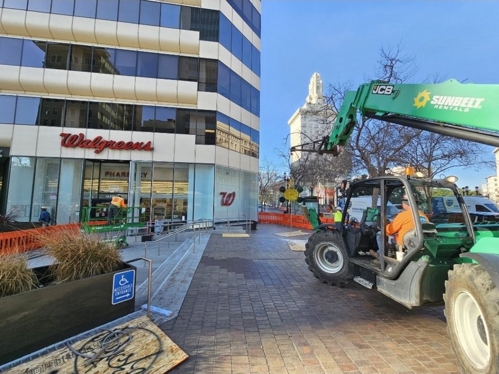 East Bay Glass replacing storefront glass at the Walgreens in downtown Oakland with a telehandler and vacuum lifter