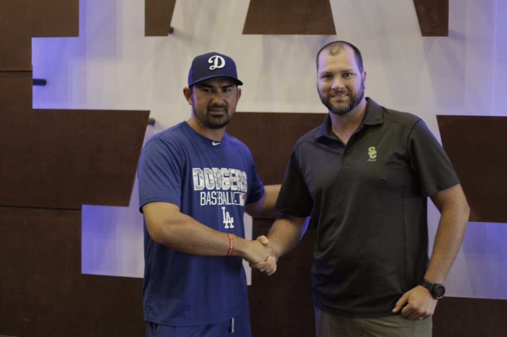 Second Chance Fields representative shaking hands with a Los Angeles Dodgers player
